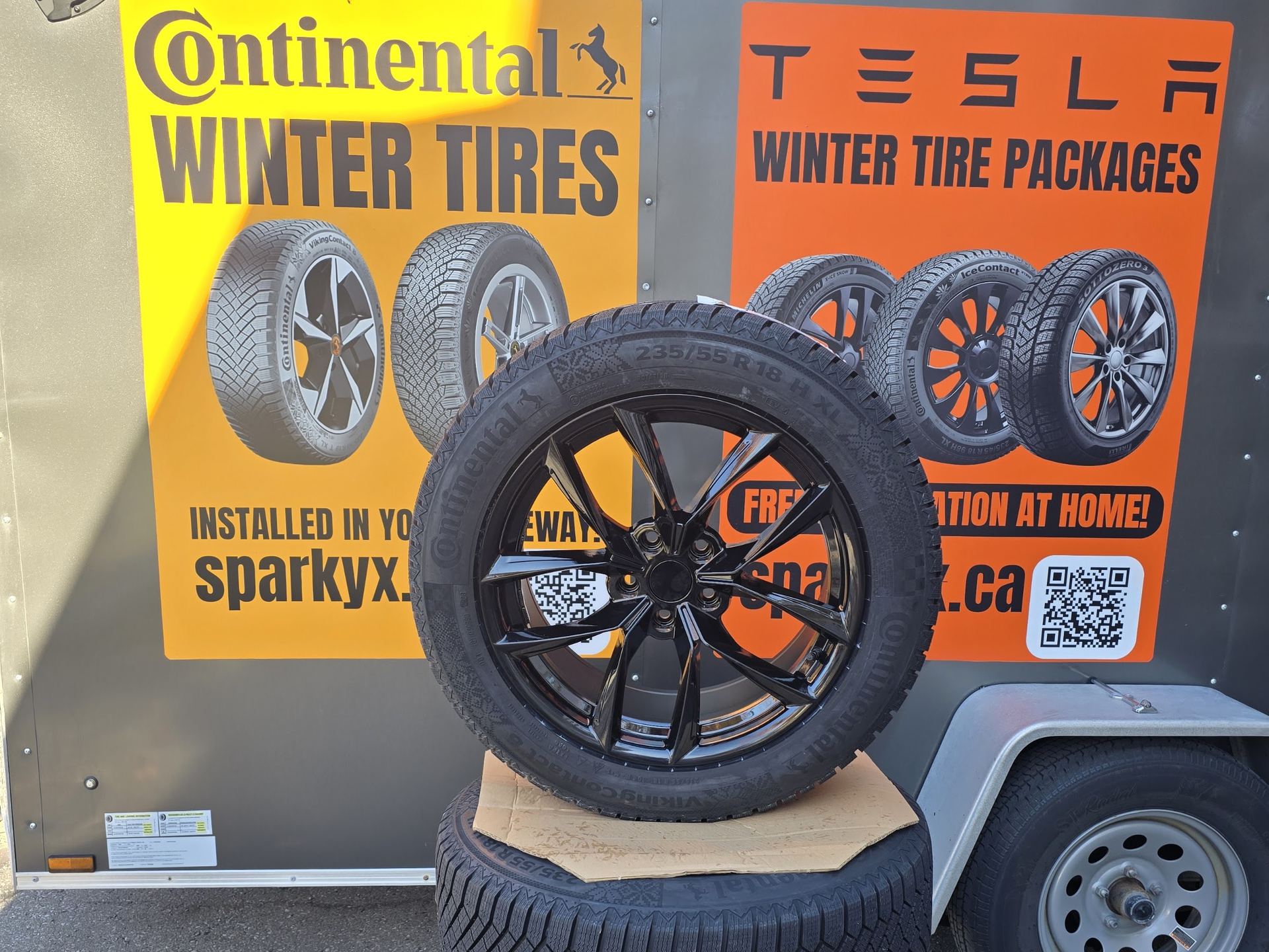 Winter tire and wheel package beside the Sparky X mobile service trailer at a GTA job site