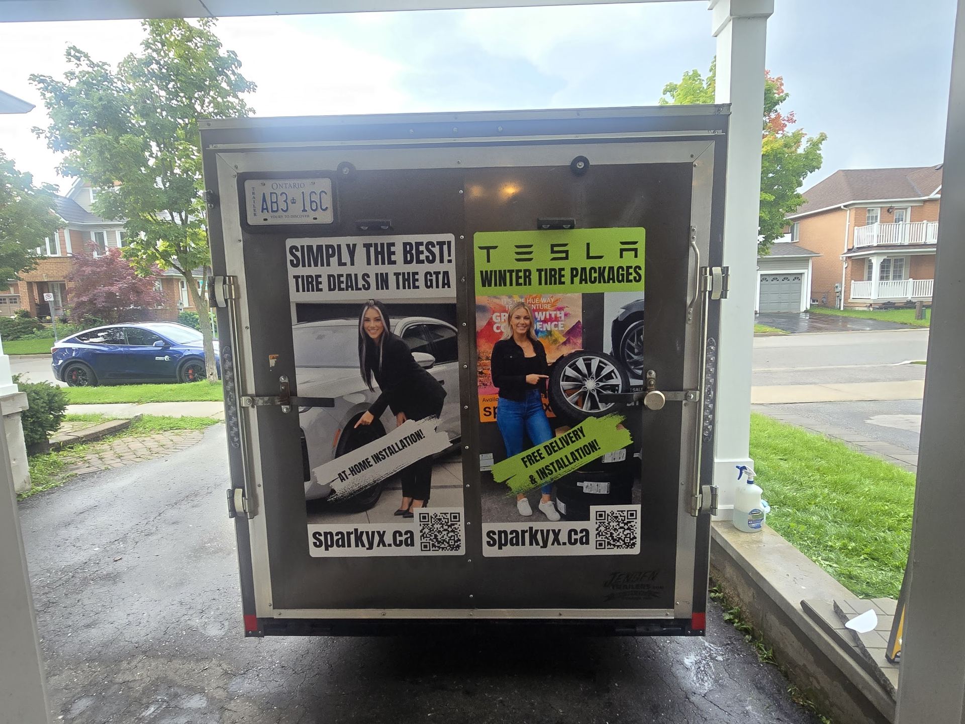 Winter tire and wheel package beside the Sparky X mobile service trailer at a GTA job site